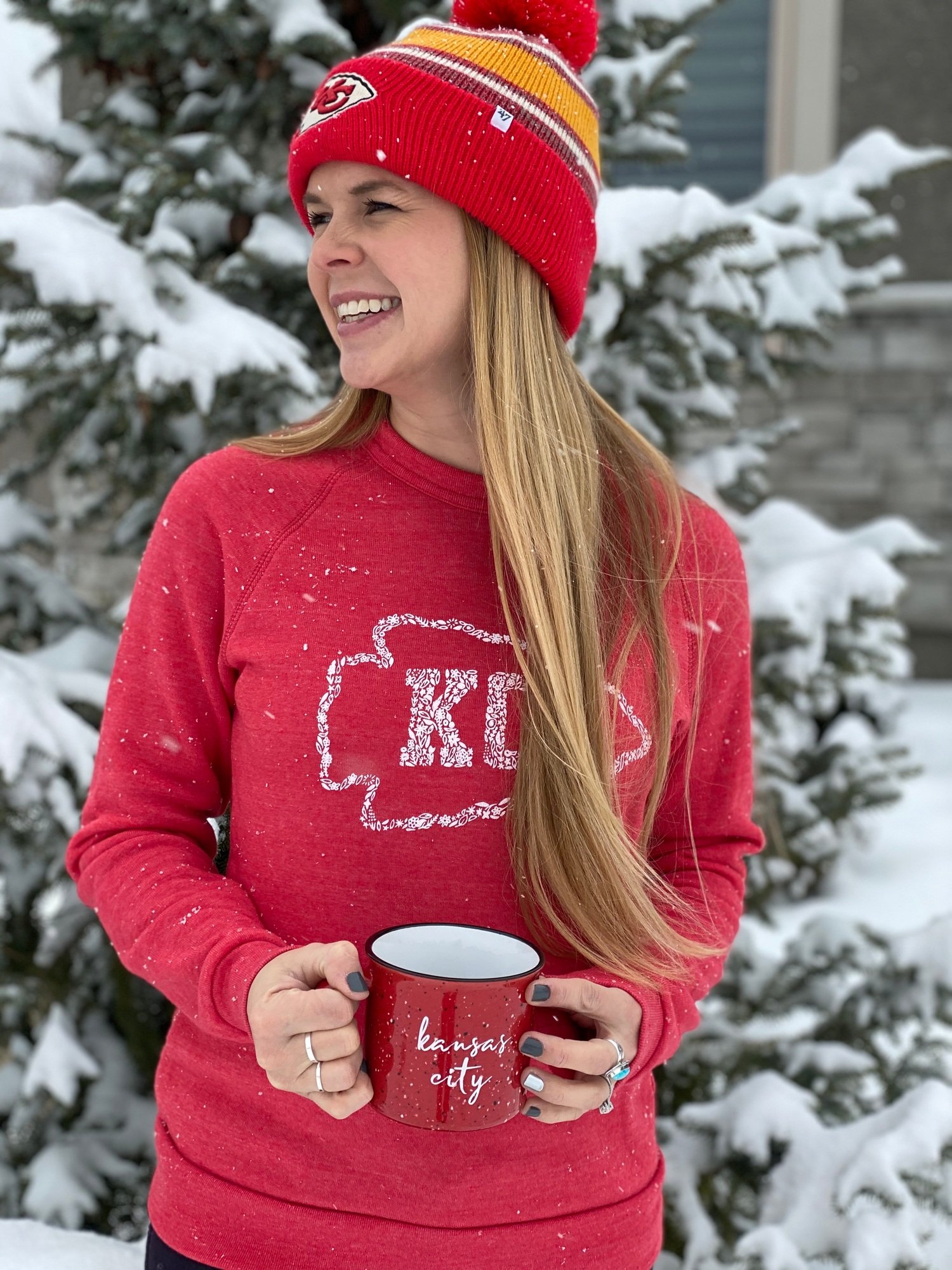 A woman in red is a Kansas City fan